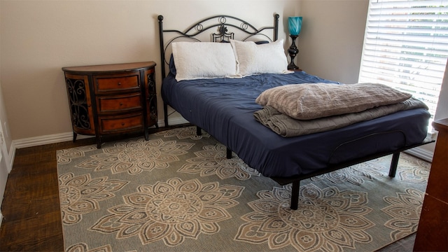 bedroom featuring dark hardwood / wood-style floors