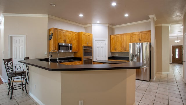 kitchen with backsplash, a kitchen breakfast bar, kitchen peninsula, stainless steel appliances, and crown molding