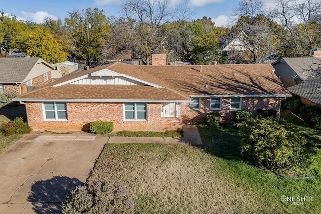 back of property featuring a yard