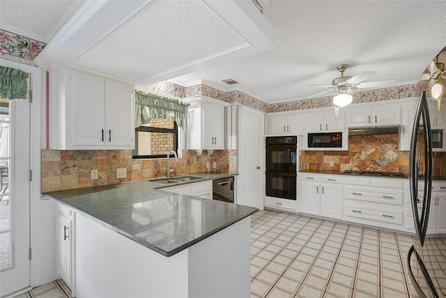 kitchen featuring black appliances, sink, white cabinets, and kitchen peninsula