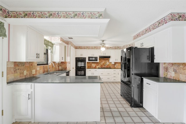 kitchen with sink, white cabinetry, black appliances, kitchen peninsula, and backsplash