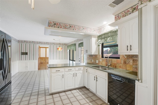 kitchen featuring sink, black appliances, a textured ceiling, kitchen peninsula, and white cabinets