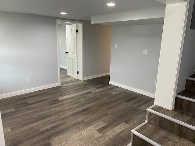 empty room featuring dark wood-type flooring