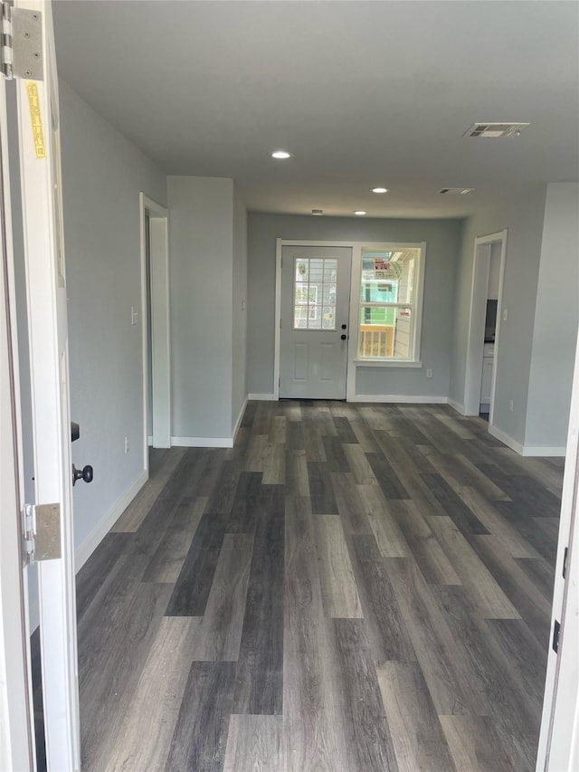 spare room with dark hardwood / wood-style floors