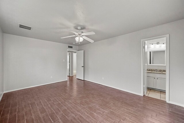 unfurnished room featuring hardwood / wood-style flooring and ceiling fan