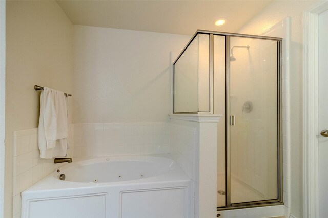 bathroom with separate shower and tub