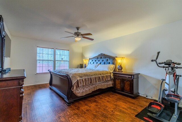 bedroom featuring ceiling fan and dark hardwood / wood-style floors