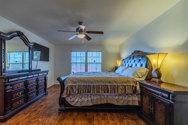 bedroom featuring dark wood-type flooring and ceiling fan