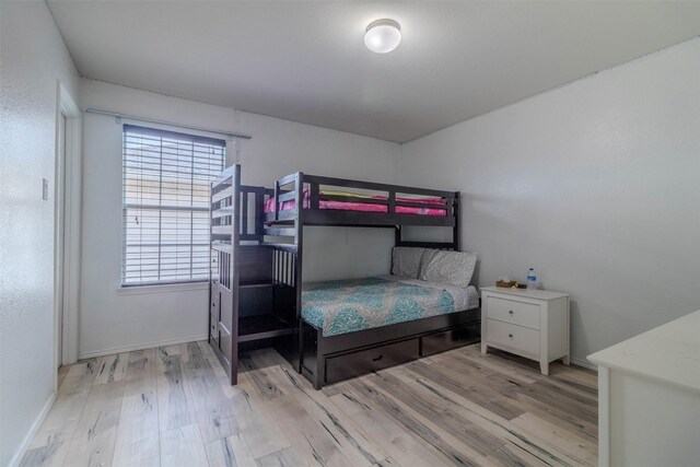 bedroom with light wood-type flooring