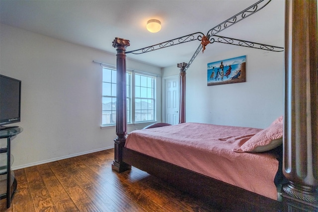 bedroom featuring dark hardwood / wood-style flooring