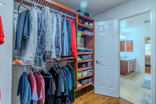 walk in closet featuring hardwood / wood-style floors