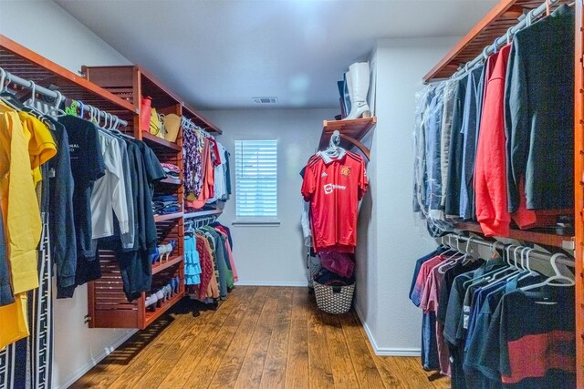 spacious closet featuring hardwood / wood-style floors