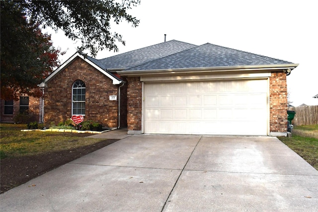 single story home featuring a garage