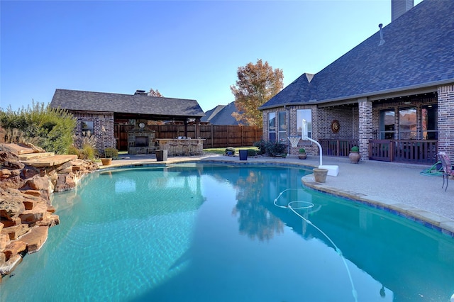 view of pool featuring a patio area and a bar