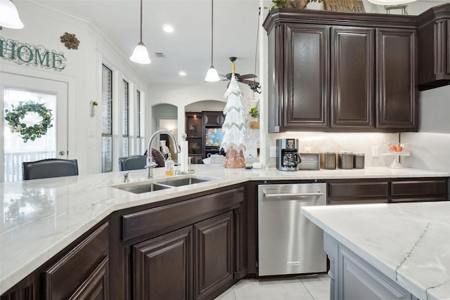 kitchen featuring dishwasher, dark brown cabinets, decorative light fixtures, and sink