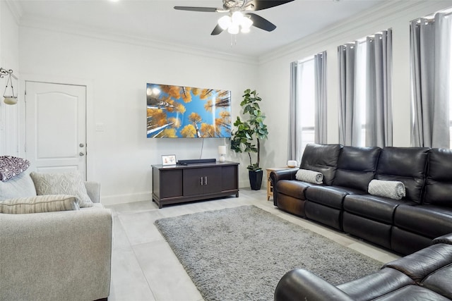 tiled living room with ceiling fan and ornamental molding