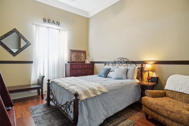 bedroom featuring dark hardwood / wood-style flooring and ornamental molding