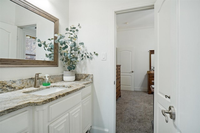 bathroom featuring vanity and ornamental molding