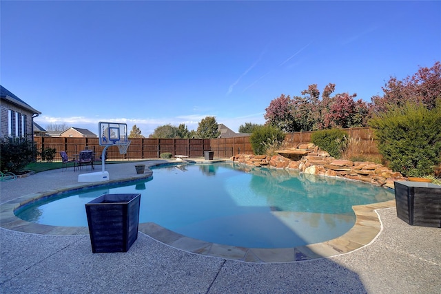 view of swimming pool with a patio area