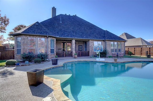 view of swimming pool with a patio area