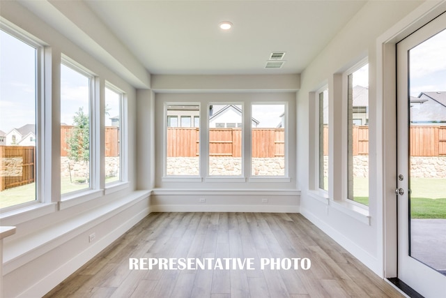 unfurnished sunroom with a healthy amount of sunlight