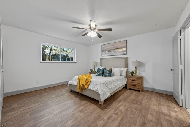 bedroom featuring ceiling fan and hardwood / wood-style flooring