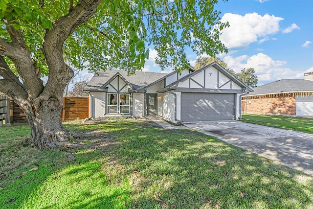 view of front of house with a garage and a front yard