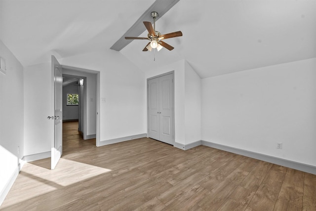 bonus room featuring ceiling fan, light hardwood / wood-style flooring, and vaulted ceiling