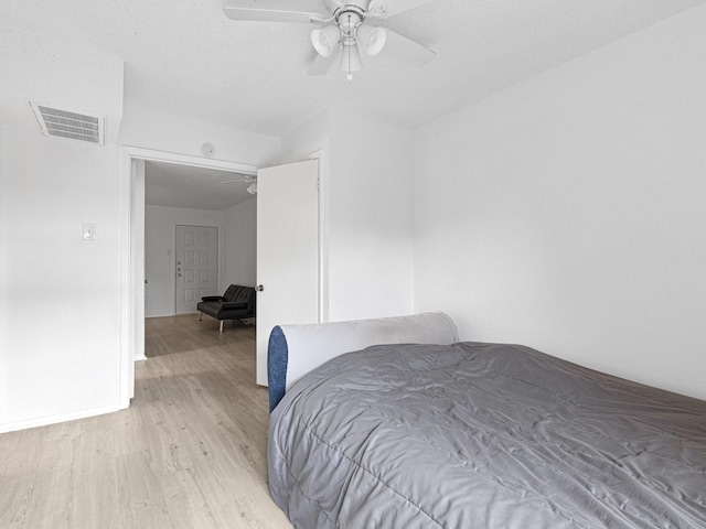 bedroom featuring ceiling fan and light hardwood / wood-style floors