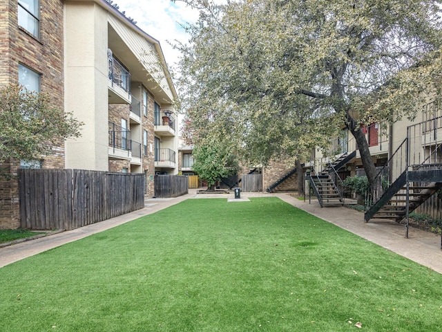 surrounding community featuring a yard