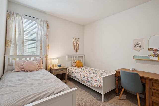 bedroom with light colored carpet