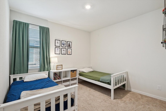 bedroom featuring multiple windows and carpet