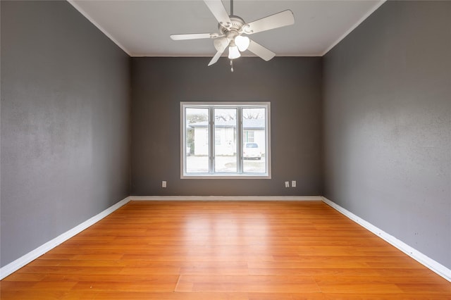 unfurnished room with ceiling fan, crown molding, and light hardwood / wood-style flooring