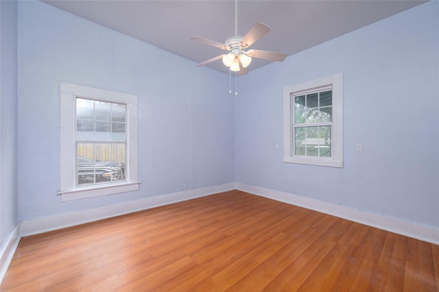 unfurnished room with ceiling fan and light wood-type flooring