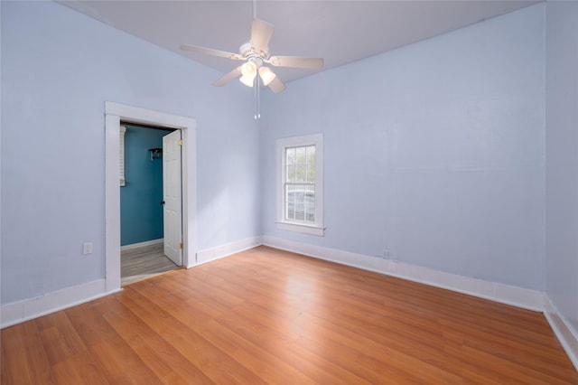 spare room featuring ceiling fan, light hardwood / wood-style flooring, and vaulted ceiling