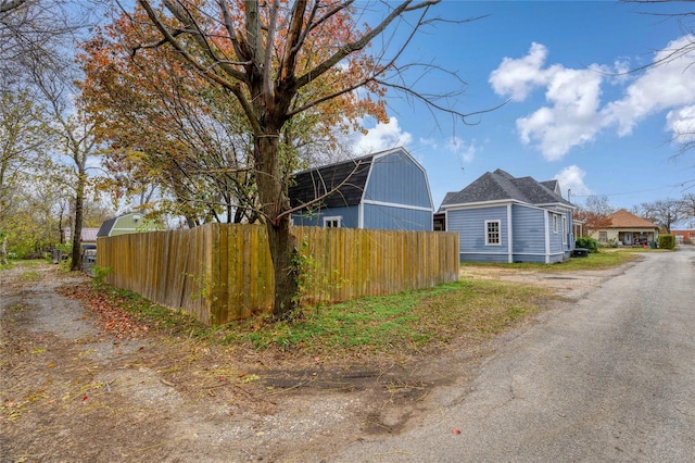 view of side of property with an outbuilding