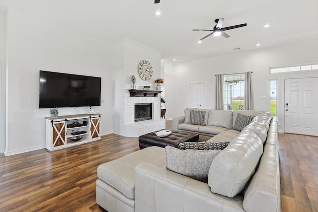 living room with recessed lighting, a brick fireplace, ceiling fan, and wood finished floors