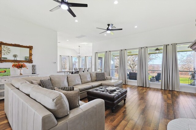 living area with dark wood-type flooring, a ceiling fan, recessed lighting, and a fireplace