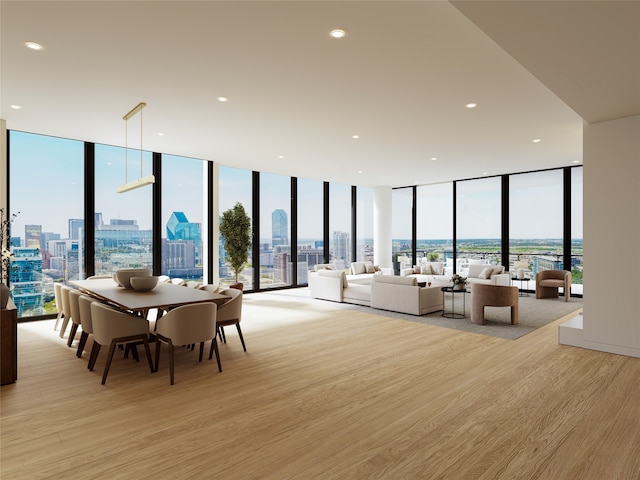 dining room with floor to ceiling windows and a wealth of natural light