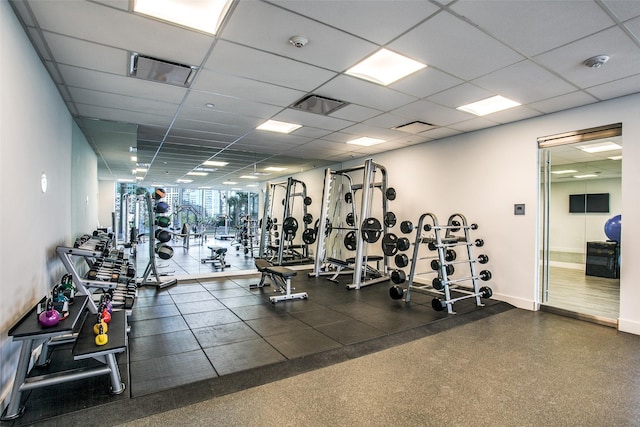 workout area featuring a paneled ceiling