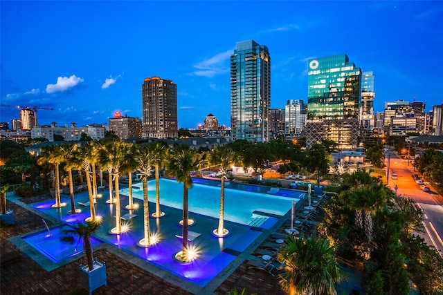 view of pool at dusk