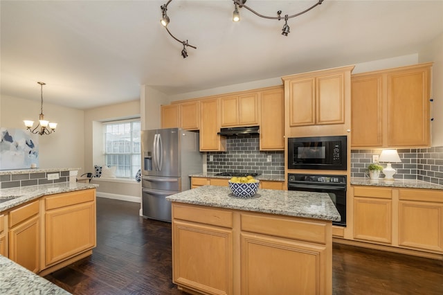 kitchen with black appliances, decorative light fixtures, dark wood-type flooring, and tasteful backsplash