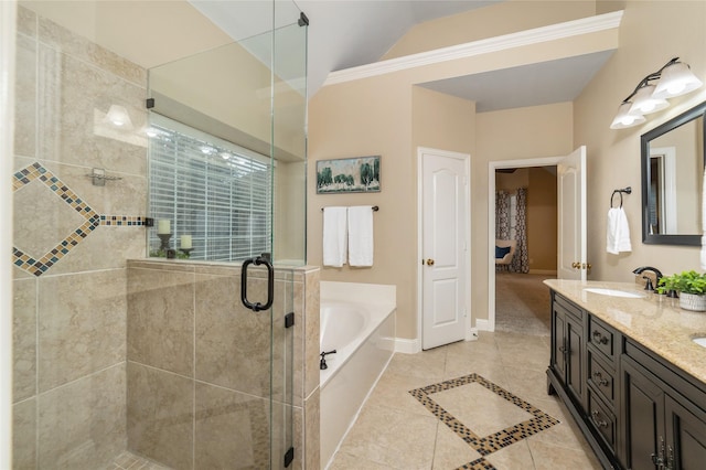 bathroom featuring tile patterned flooring, vanity, independent shower and bath, and lofted ceiling