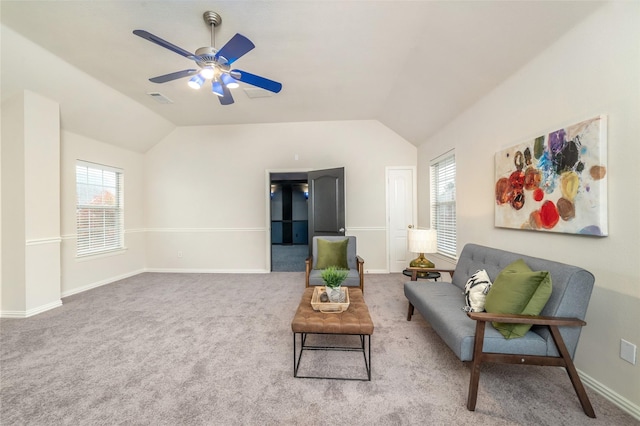 living room with ceiling fan, carpet floors, and vaulted ceiling