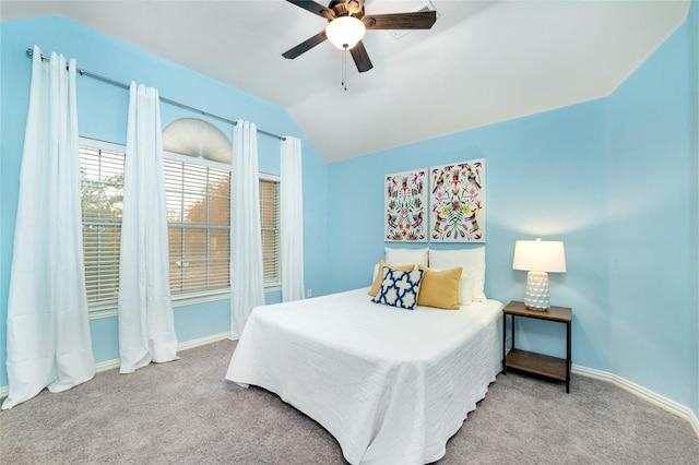 carpeted bedroom featuring ceiling fan and lofted ceiling