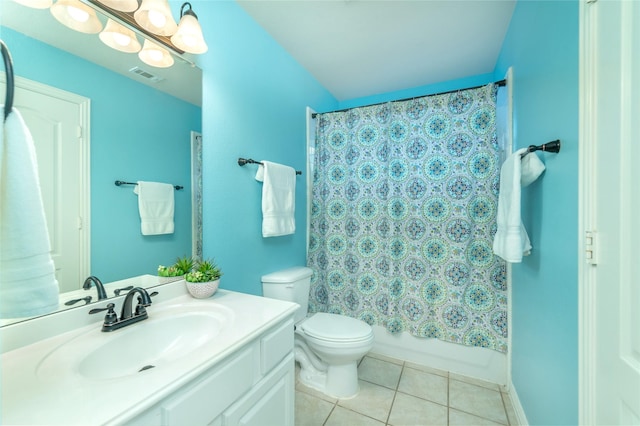 full bathroom featuring tile patterned flooring, shower / tub combo, vanity, and toilet