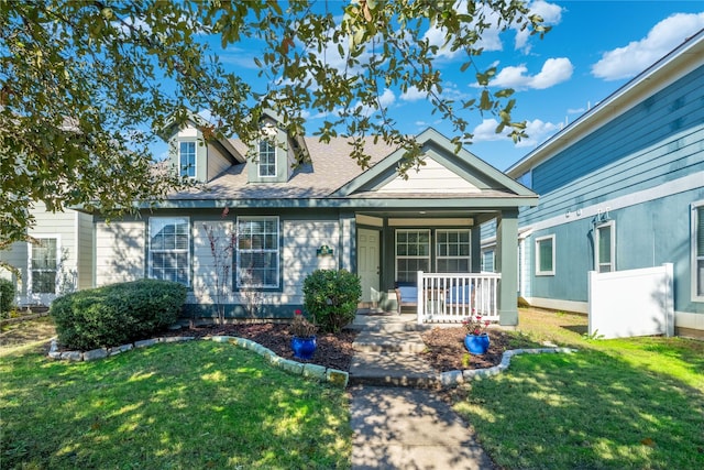 view of front of house featuring a porch and a front yard