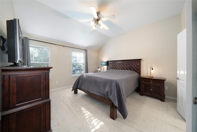 bedroom with lofted ceiling, light colored carpet, and ceiling fan