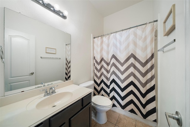 bathroom with toilet, a shower with shower curtain, vanity, and tile patterned floors