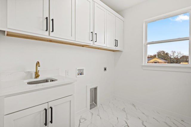 clothes washing area featuring electric dryer hookup, cabinets, sink, and hookup for a washing machine